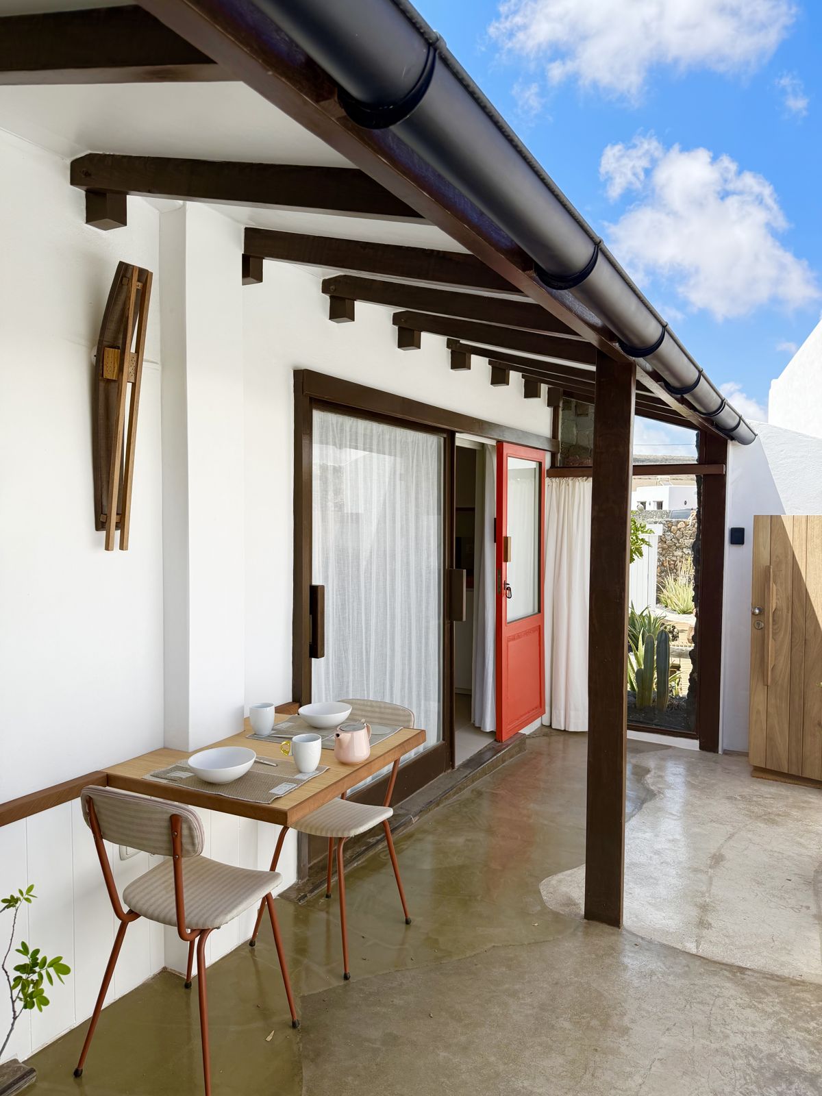 El Sol de la Mañana — the morning terrace with the red door